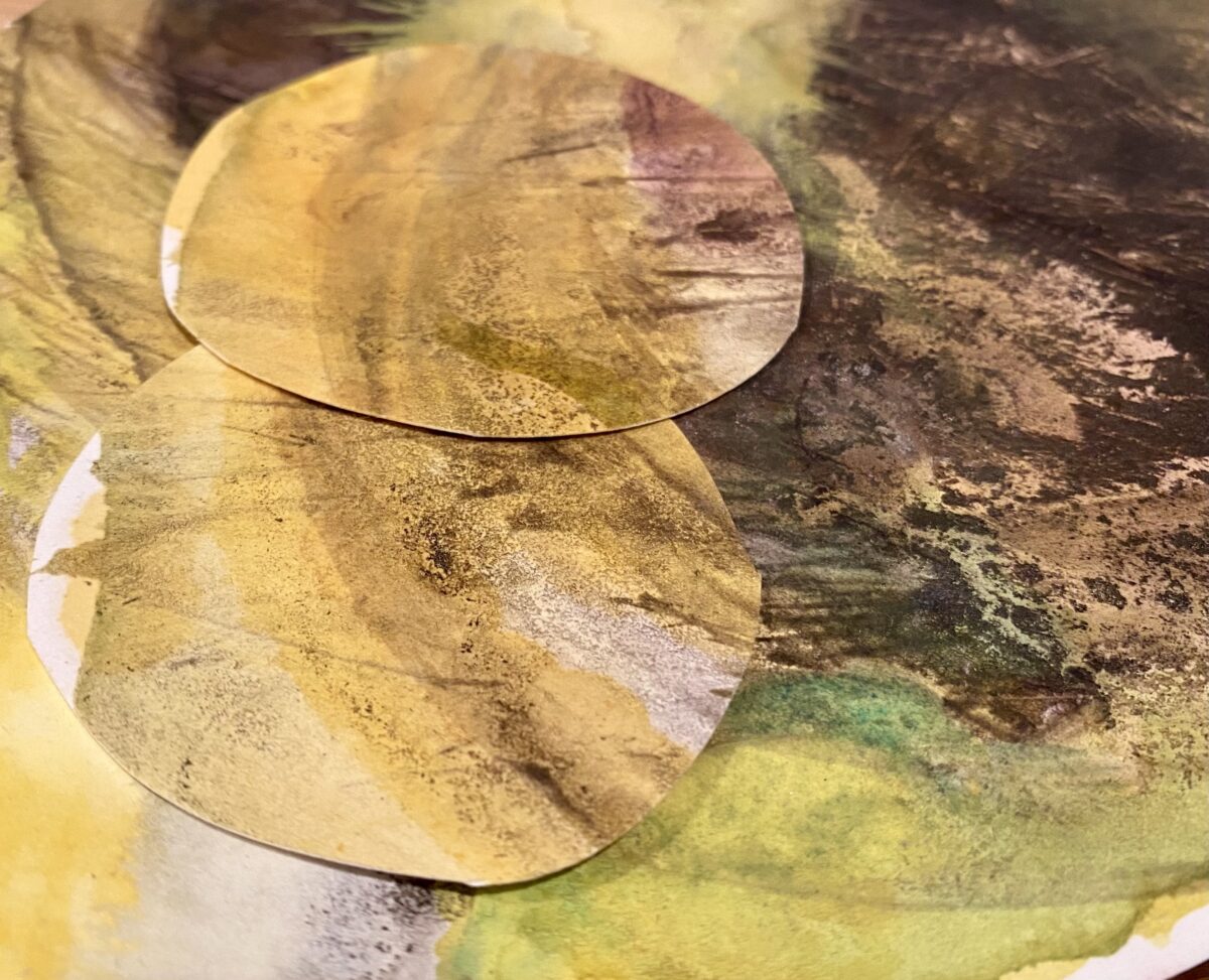 A watercolor showing cut outs mostly in earth tones